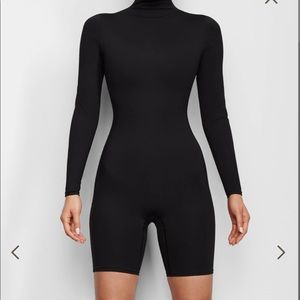 Skims ALL-IN-ONE LONG SLEEVE MID THIGH ONESIE